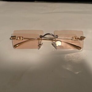 Elegant Pink Rimless Sunglasses